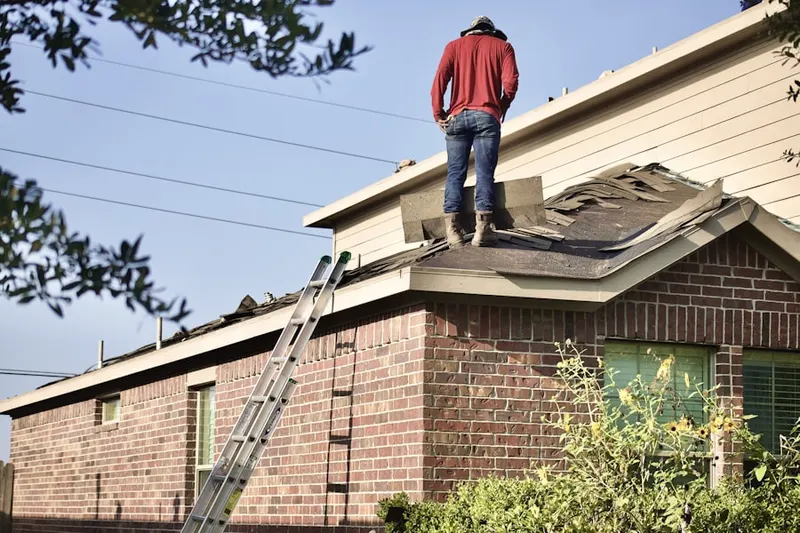 Professional roofer working on a residential roof in Stockton